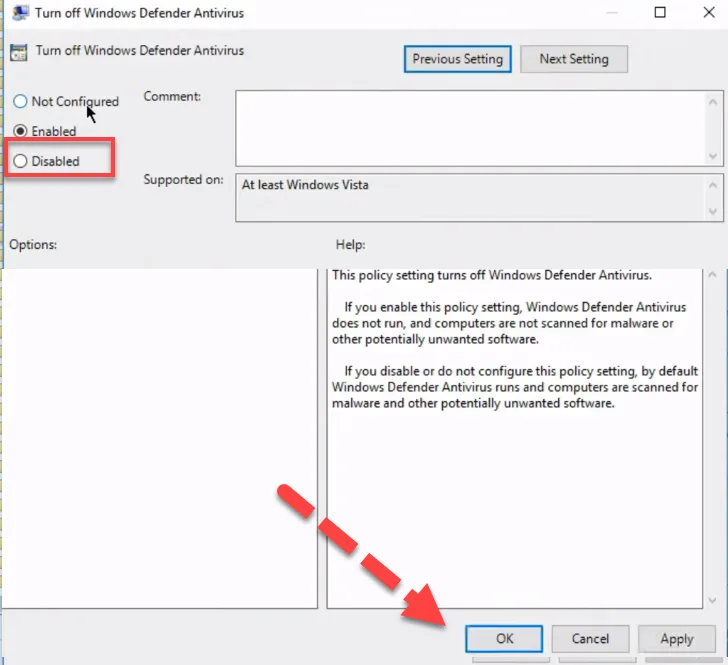 Turn off Windows Defender Antivirus policy dialog with a red arrow pointing to the OK button