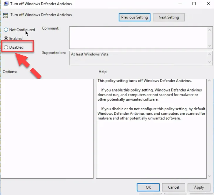 Turn off Windows Defender Antivirus policy dialog with a red arrow pointing to the Disabled radio button