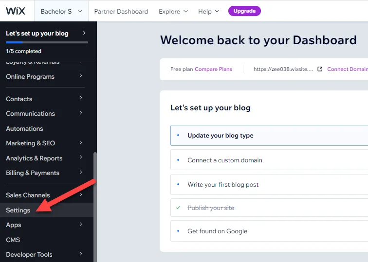 Wix dashboard sidebar with a red arrow pointing to the Settings menu item near the bottom