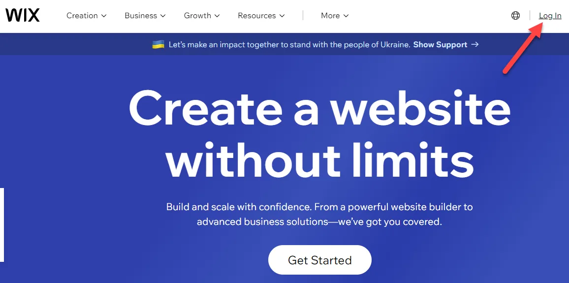 Wix homepage with a red arrow pointing to the Log In link in the top right corner