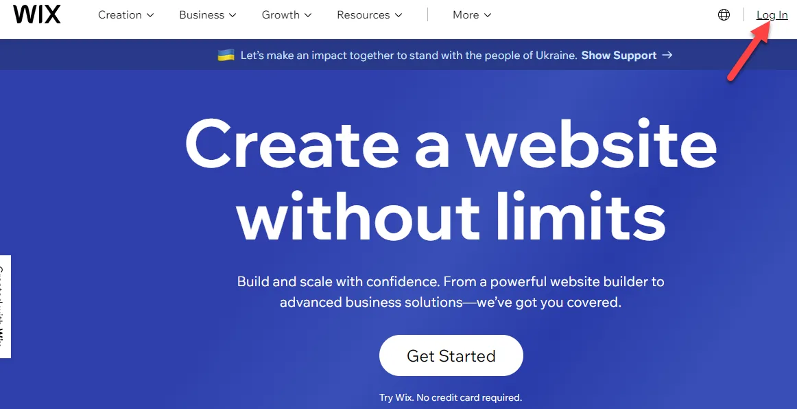 Wix homepage with a red arrow pointing to the Log In link in the top right corner