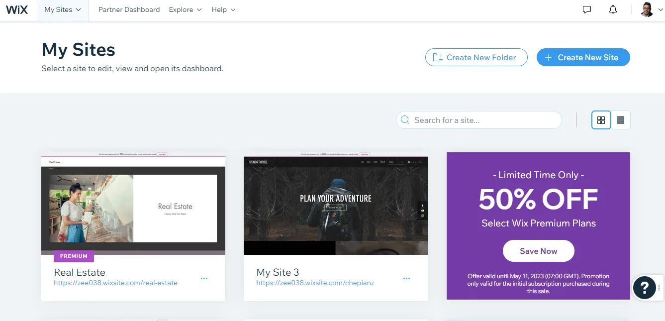 Wix My Sites grid view showing two site thumbnails beside a fifty percent off premium plans promotion