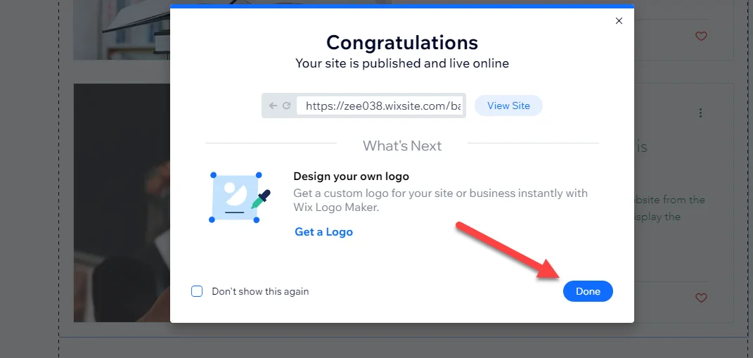Wix Congratulations dialog confirming the site is published and live, with a red arrow pointing to the Done button